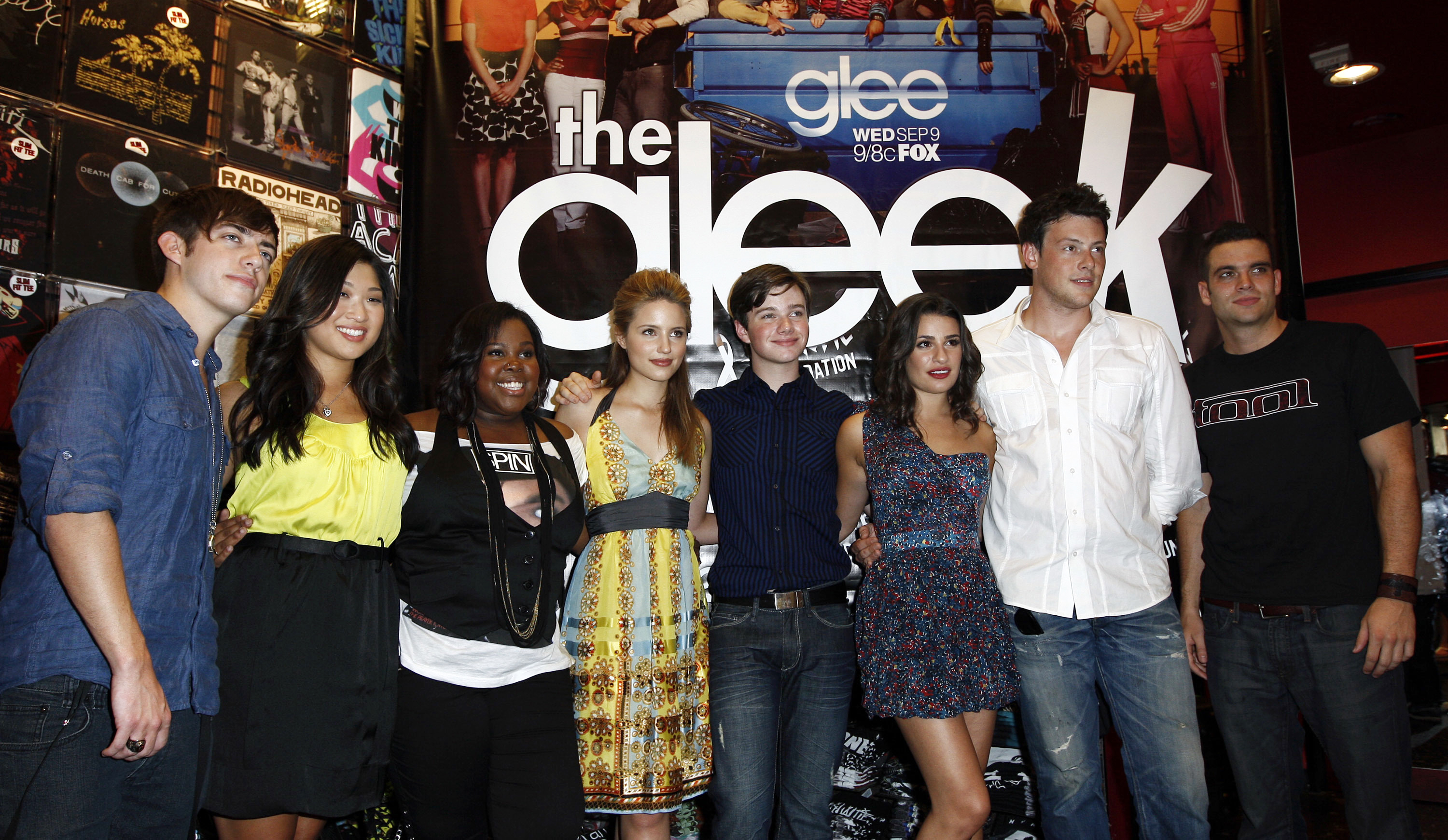 FILE - In this Aug. 28, 2009 file photo, cast members, from left, Kevin McHale, Jenna Ushkowitz, Amber Riley, Dianna Agron, Chris Colfer, Lea Michele, Cory Monteith, and Mark Salling pose for photographers during The Gleek Tour for the television show "Glee" in Los Angeles.  