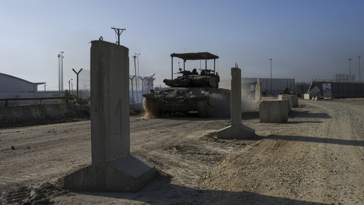 Israeli army tanks move along the Gaza Strip border.