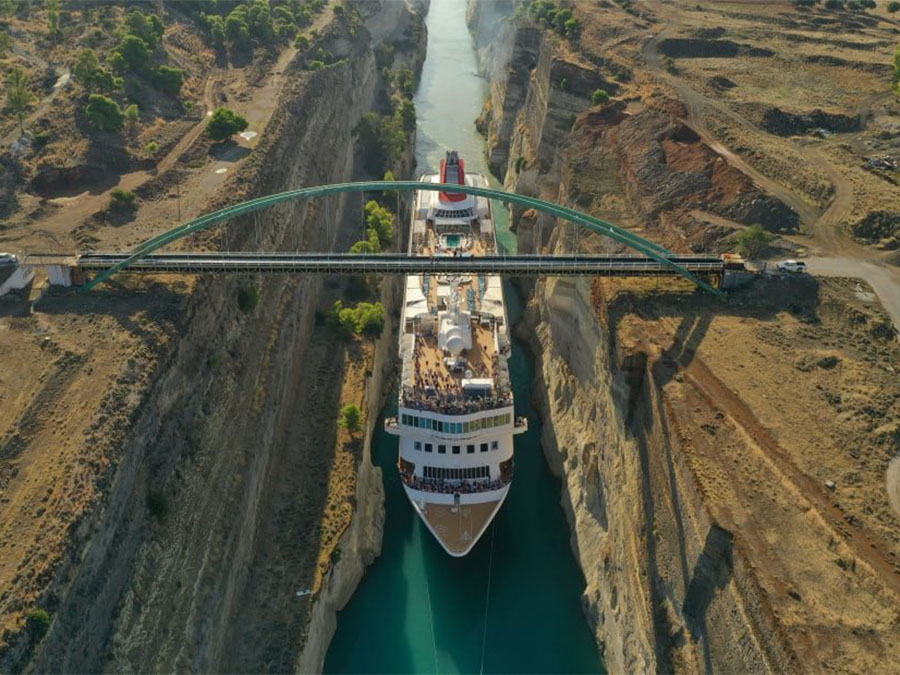 Huge cruise ship squeezes through Greek canal to claim record