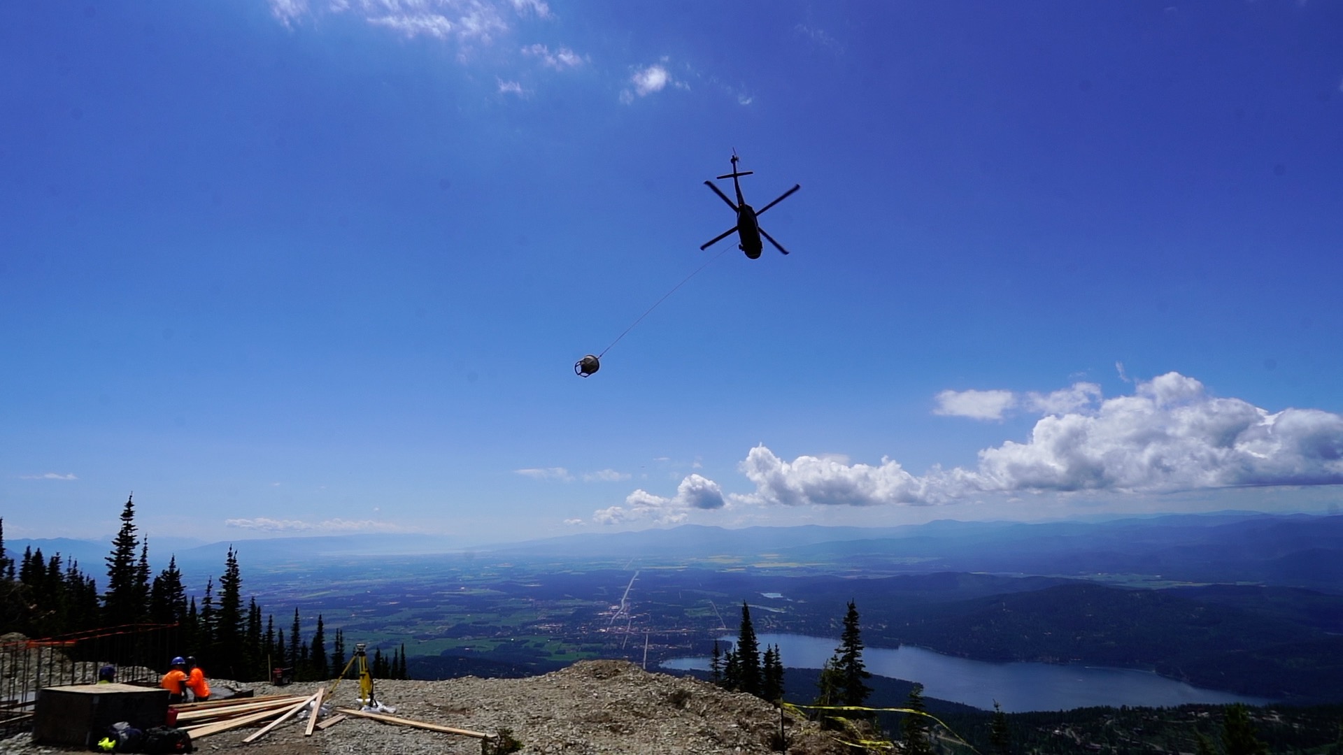Helicopter transporting concrete 
