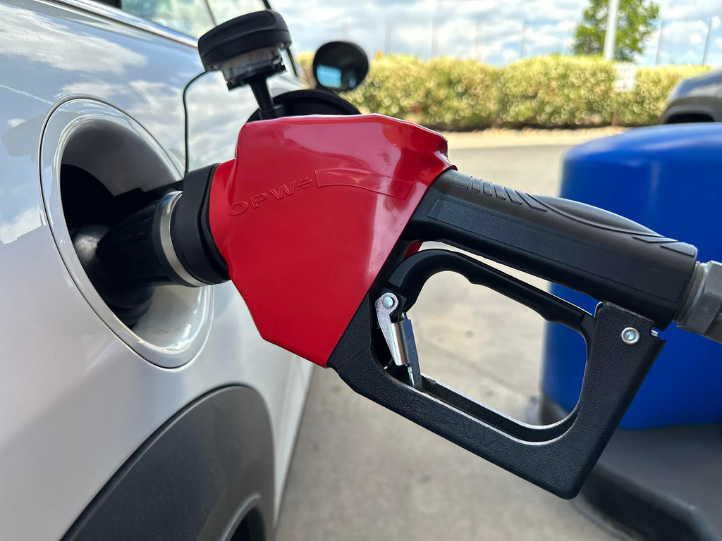 A motorist fills up the tank of a vehicle at a gas station, Sunday, May 24, 2026, in Sheridan, Colo.