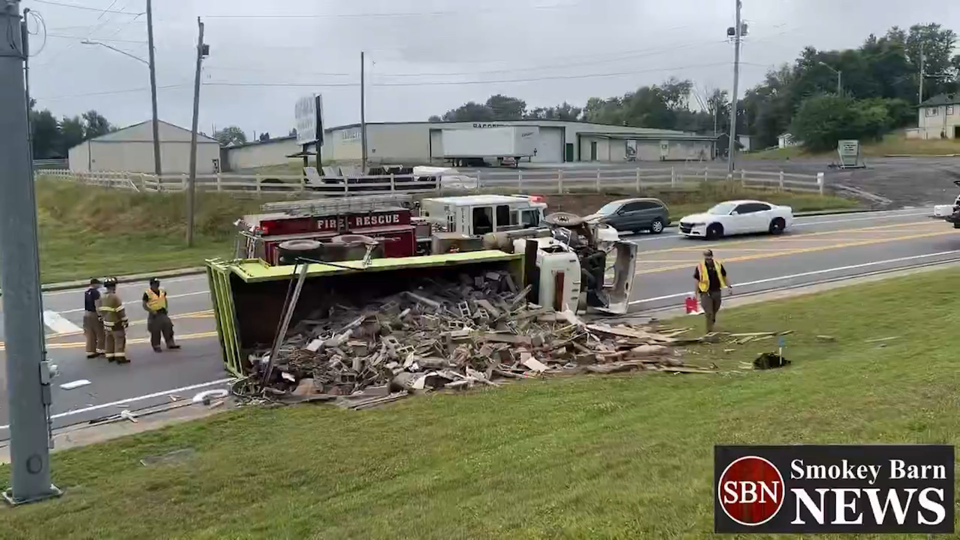 Dump truck hauling concrete overturns in Springfield