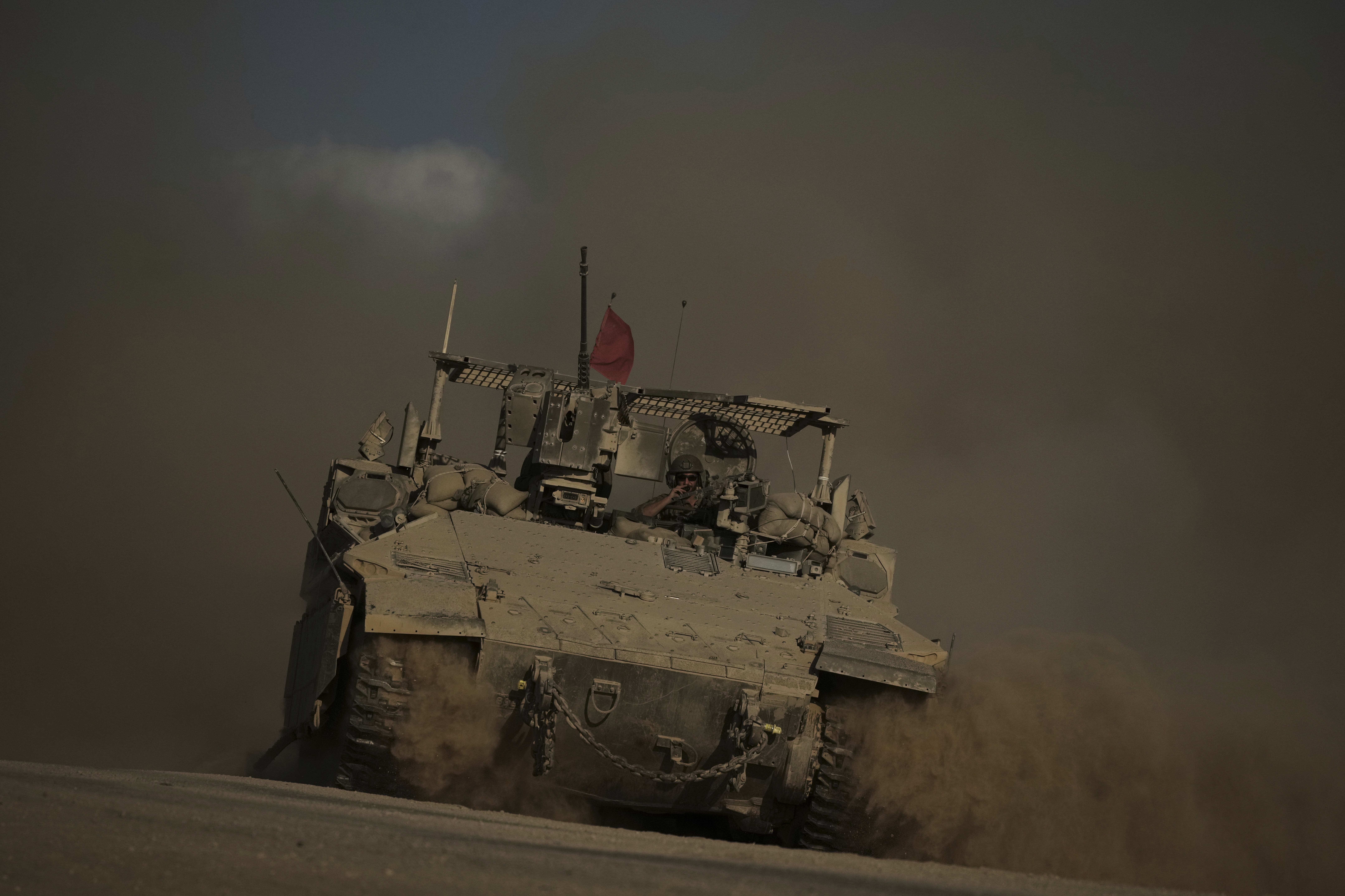 An Israeli armored vehicle moves along the Israeli-Gaza border as seen from southern Israel, Tuesday, Sept. 16, 2025. 