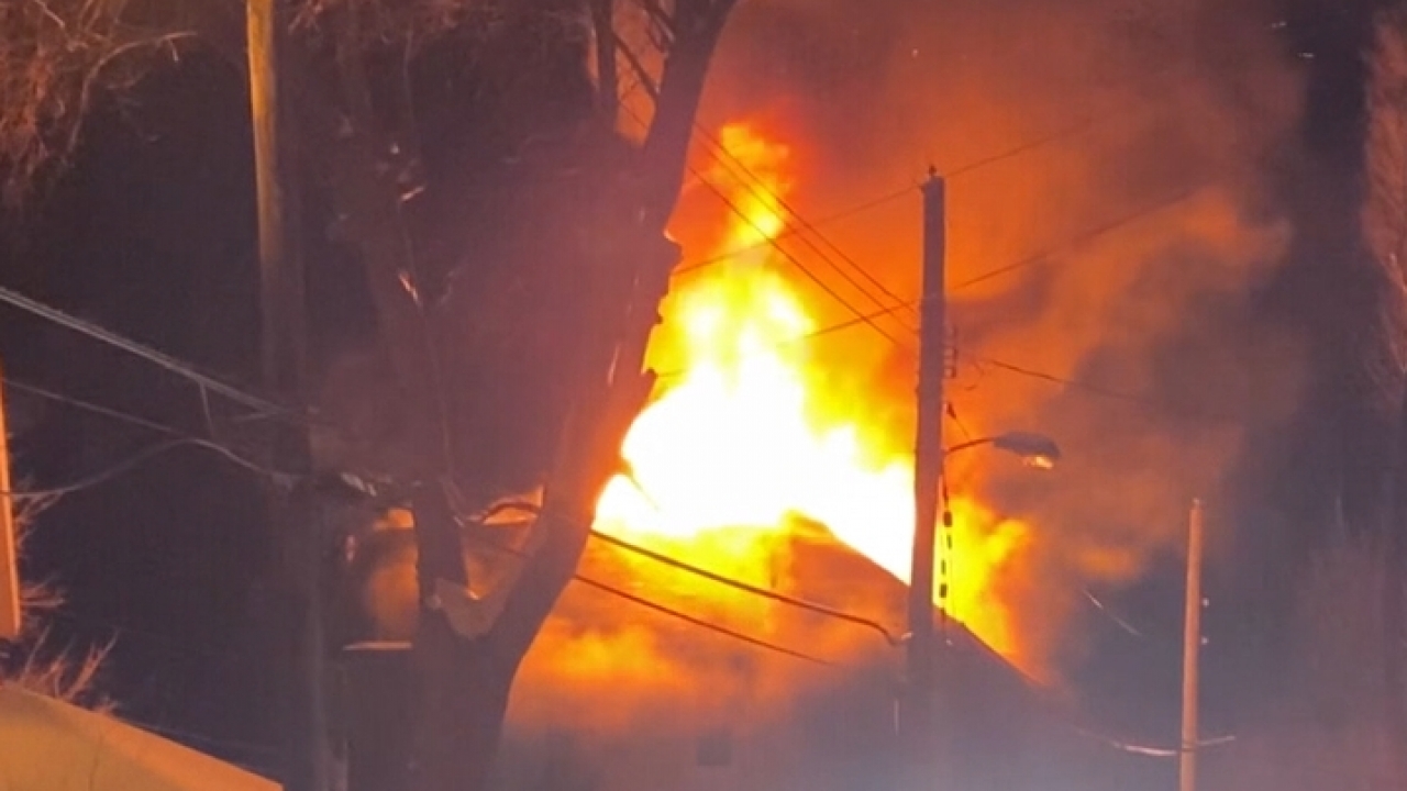 Flames shooting out of a home at night in South Bend, Indiana.