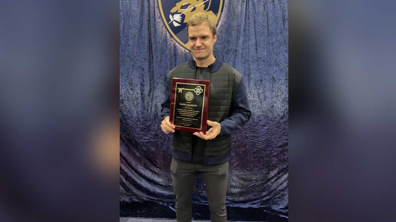 Florida captain Aleksander Barkov holds the key to the city proclamation awarded to him by the Boca Raton Mayor