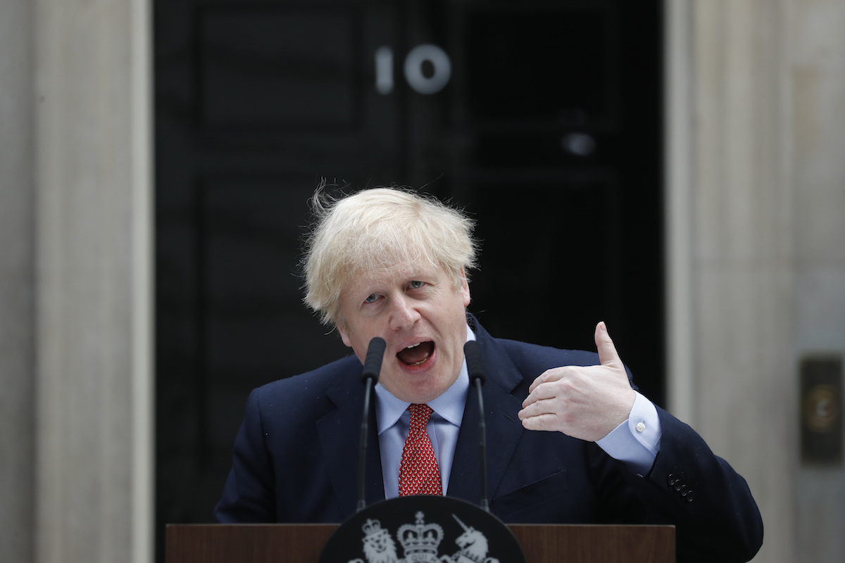 Back at work, Boris Johnson urges patience over UK lockdown