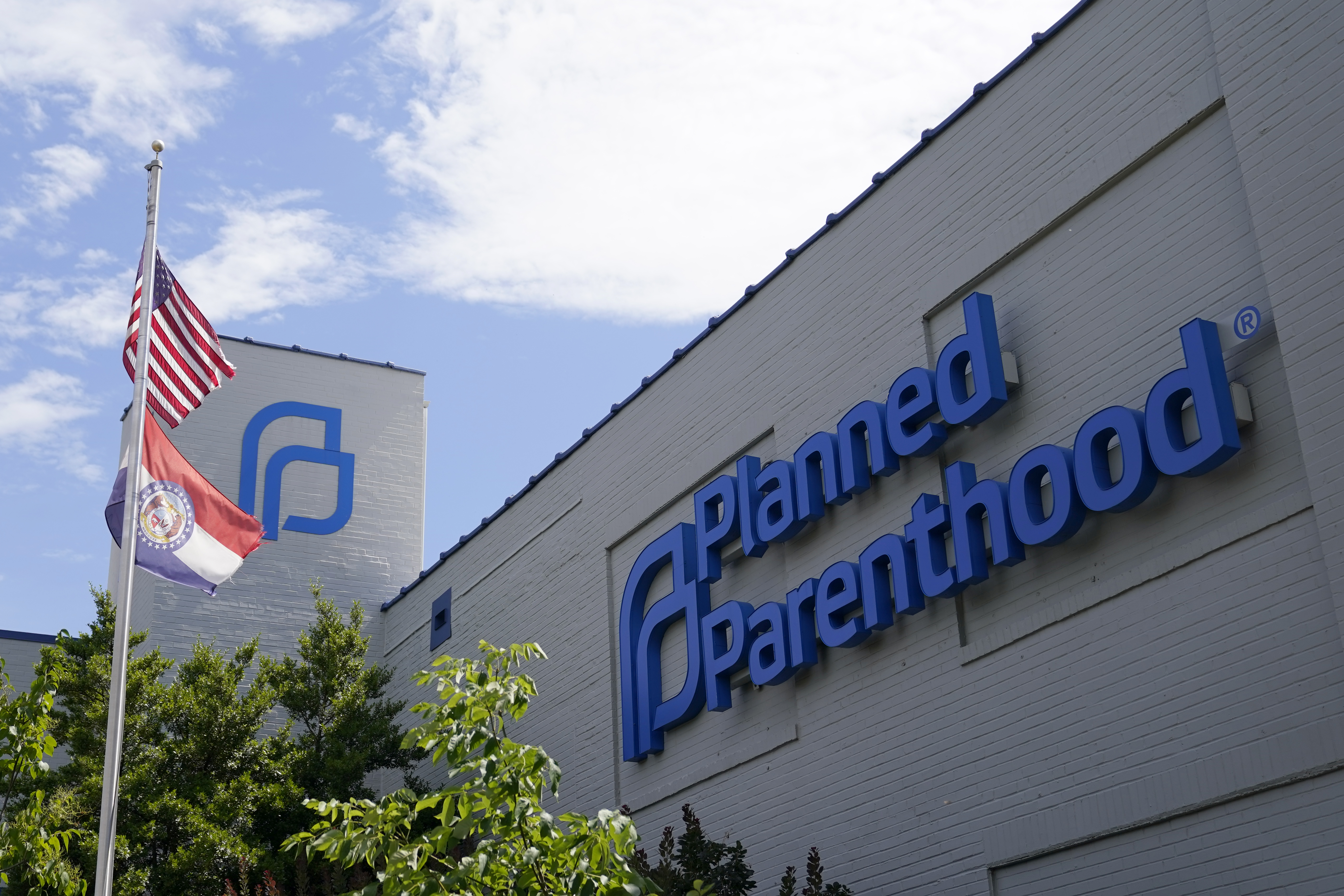 A Missouri and American flag fly outside Planned Parenthood in St. Louis, June 24, 2022. 