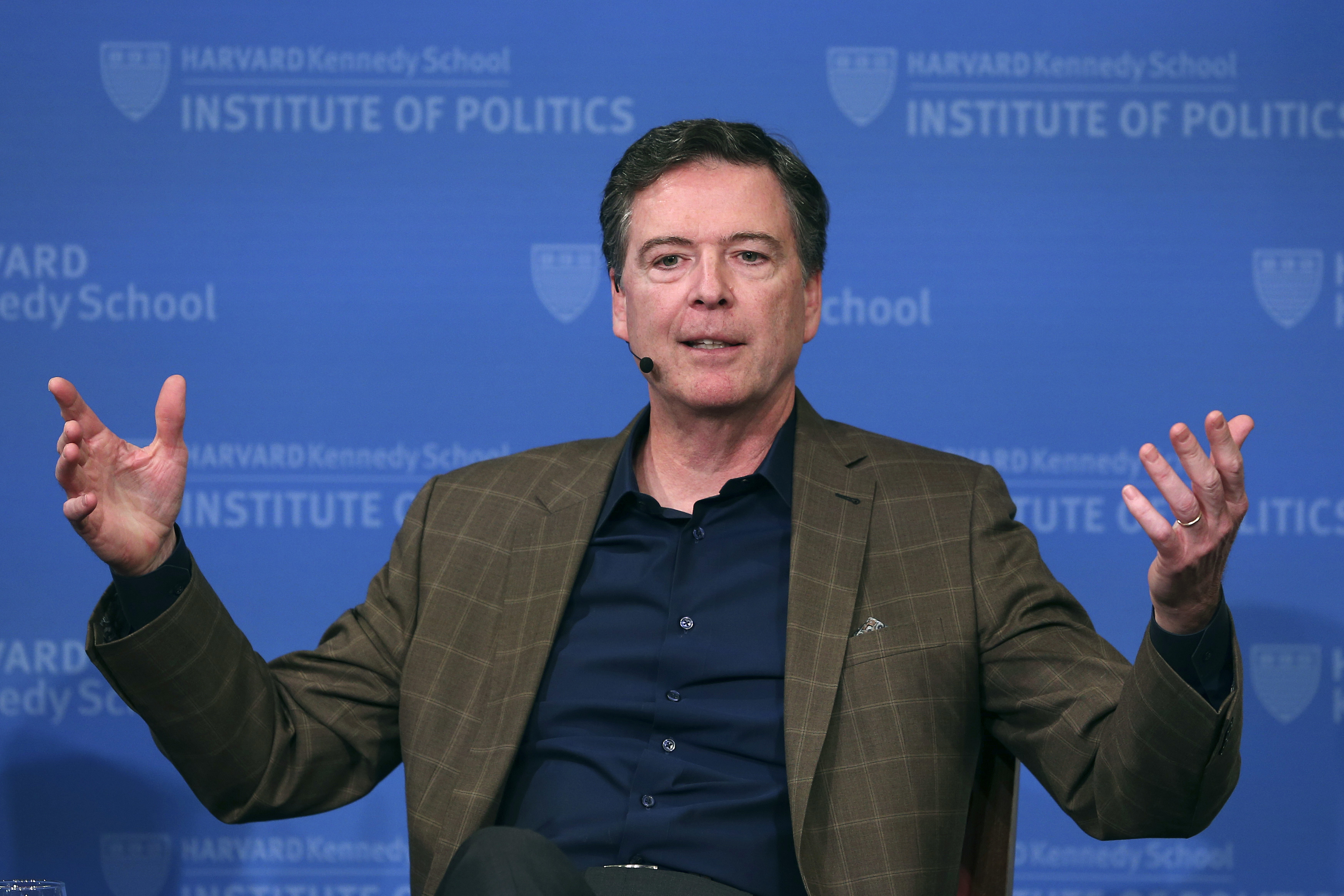 FILE - Former FBI director James Comey gestures while speaking at Harvard University's Institute of Politics' JFK Jr. Forum in Cambridge, Mass., Feb. 24, 2020. 