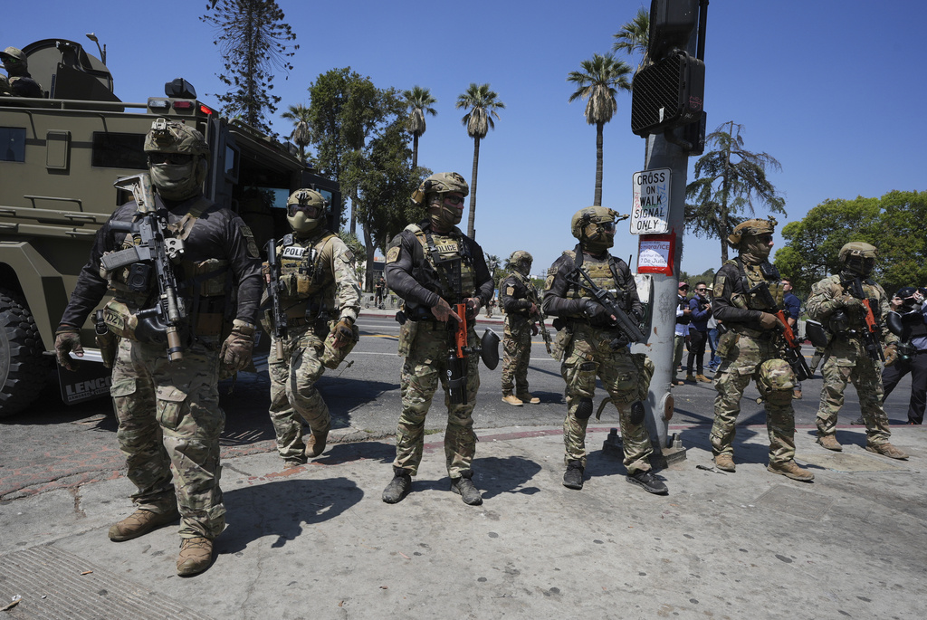 Federal agents stage at MacArthur Park Monday, July 7, 2025, in Los Angeles.