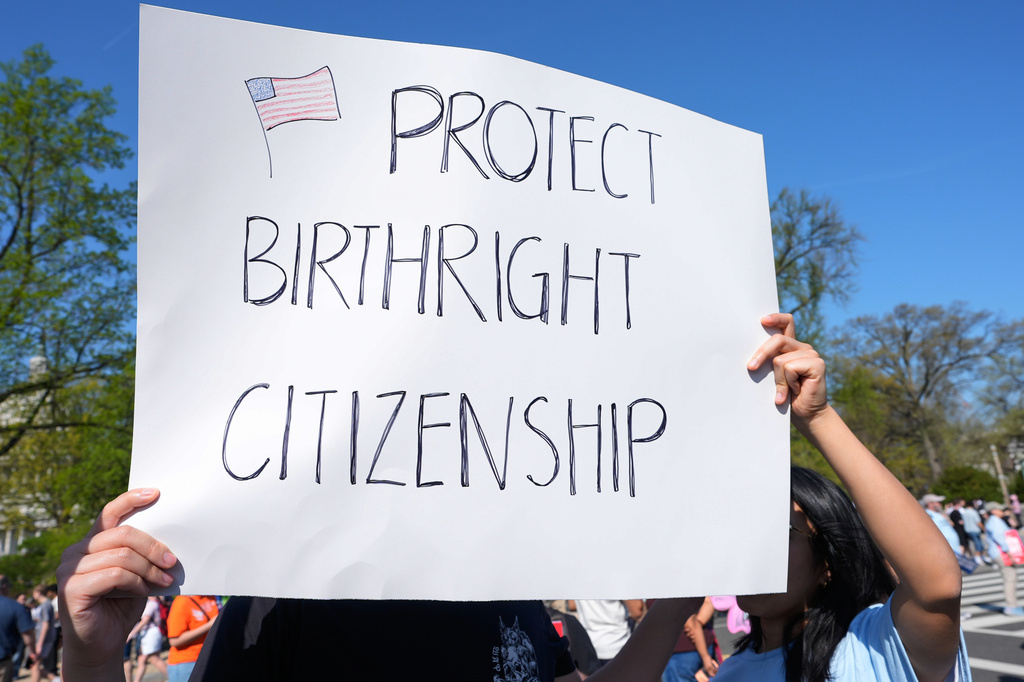 FILE: Supporters of birthright citizenship rally outside the Supreme Court as the justices hear oral arguments on whether President Donald Trump can deny citizenship to children born to parents who are in the United States illegally or temporarily, on Capitol Hill, in Washington, Wednesday, April 1, 2026. 