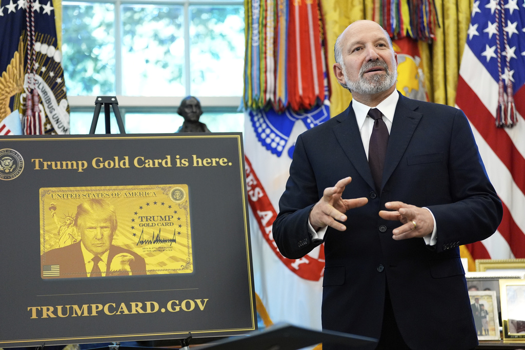Commerce Secretary Howard Lutnick speaks as President Donald Trump prepares to sign the Gold Card executive order in the Oval Office of the White House, Monday, Sept. 15, 2025, in Washington.