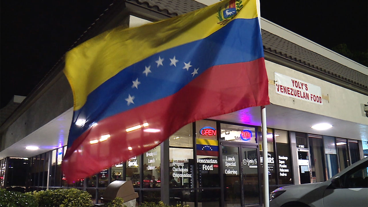 A Venezuelan flag flies outside Yoly's Venezuelan Food along Jog Road in Greenacres on Jan. 3, 2026.