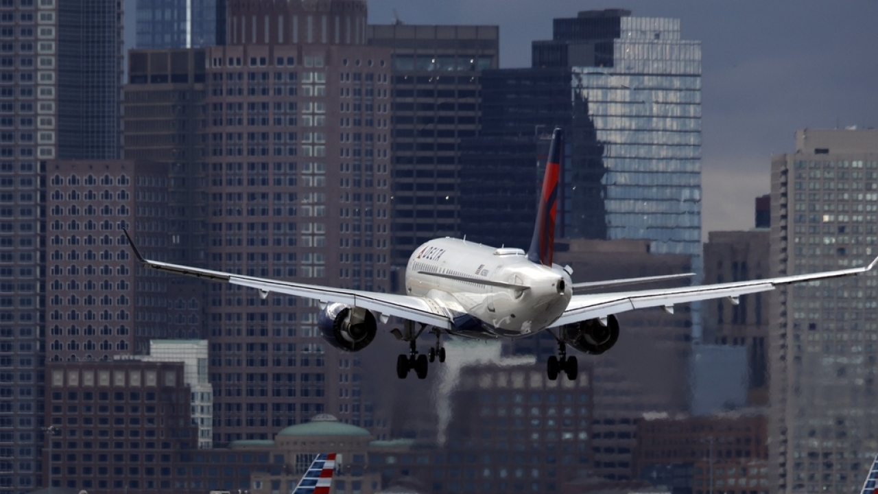 A Delta Air Lines plane lands at Logan International Airport.