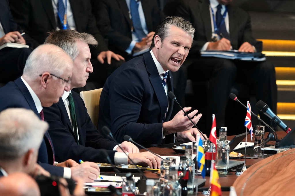 United States Defense Secretary Pete Hegseth, right, speaks during a meeting of the North Atlantic Council in defense ministers format at NATO headquarters in Brussels, Thursday, June 18, 2026. 