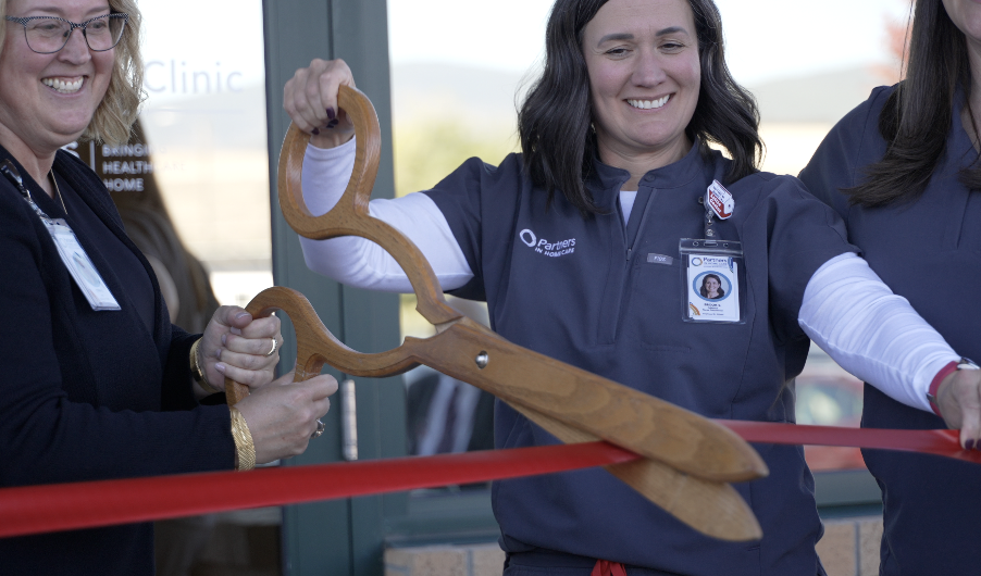 Ribbon cutting ceremony celebrating grand opening