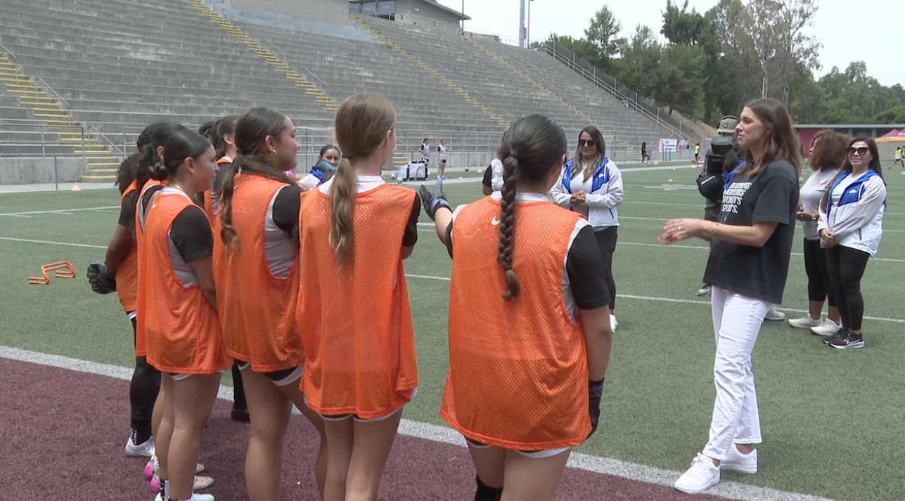 Morgan talking to some soccer players at Let's Go South Bay! Girls soccer empowerment camp. 