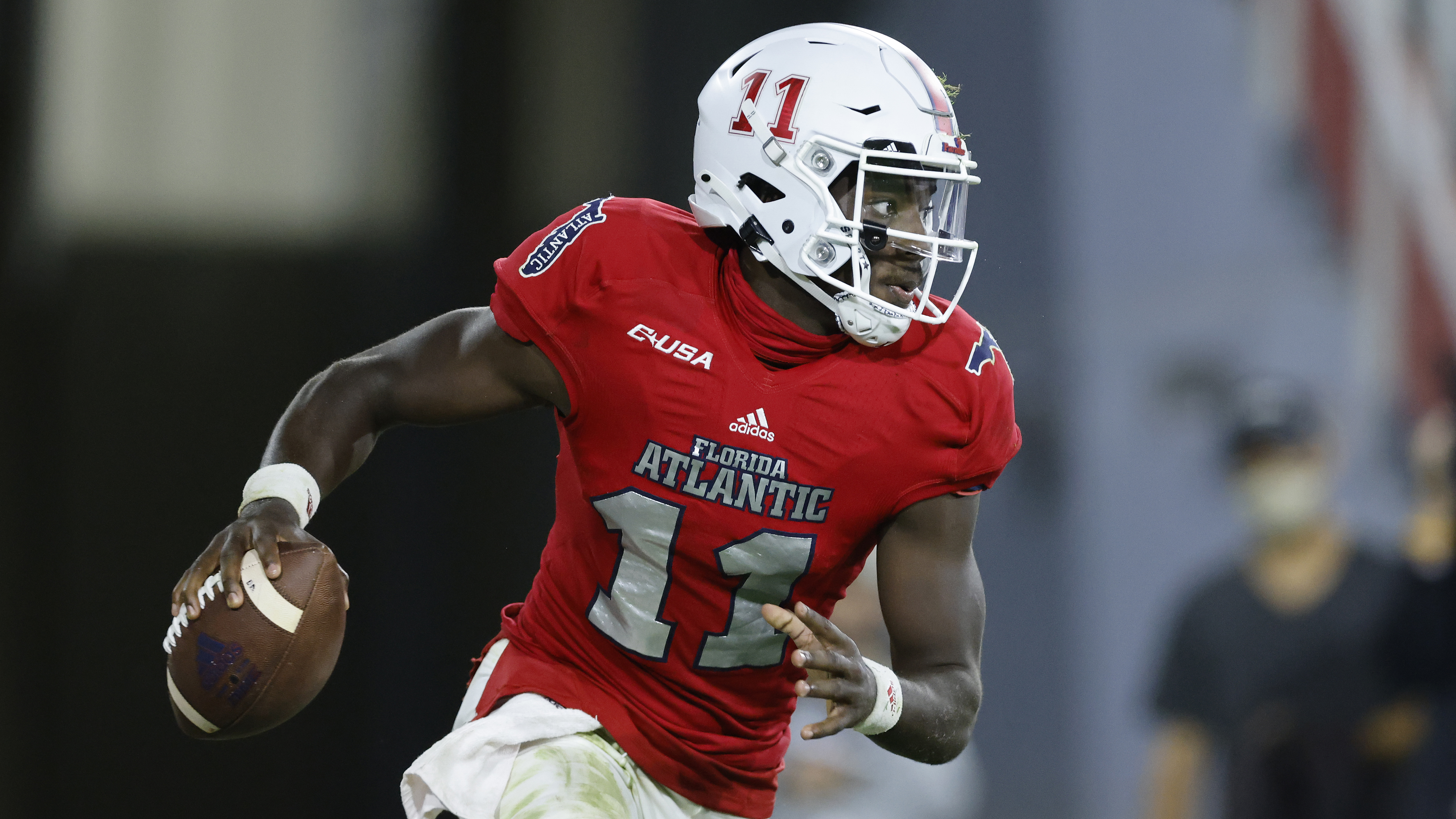 FAU Owls QB Javion Posey scrambles vs. Massachusetts Minutemen in 2020