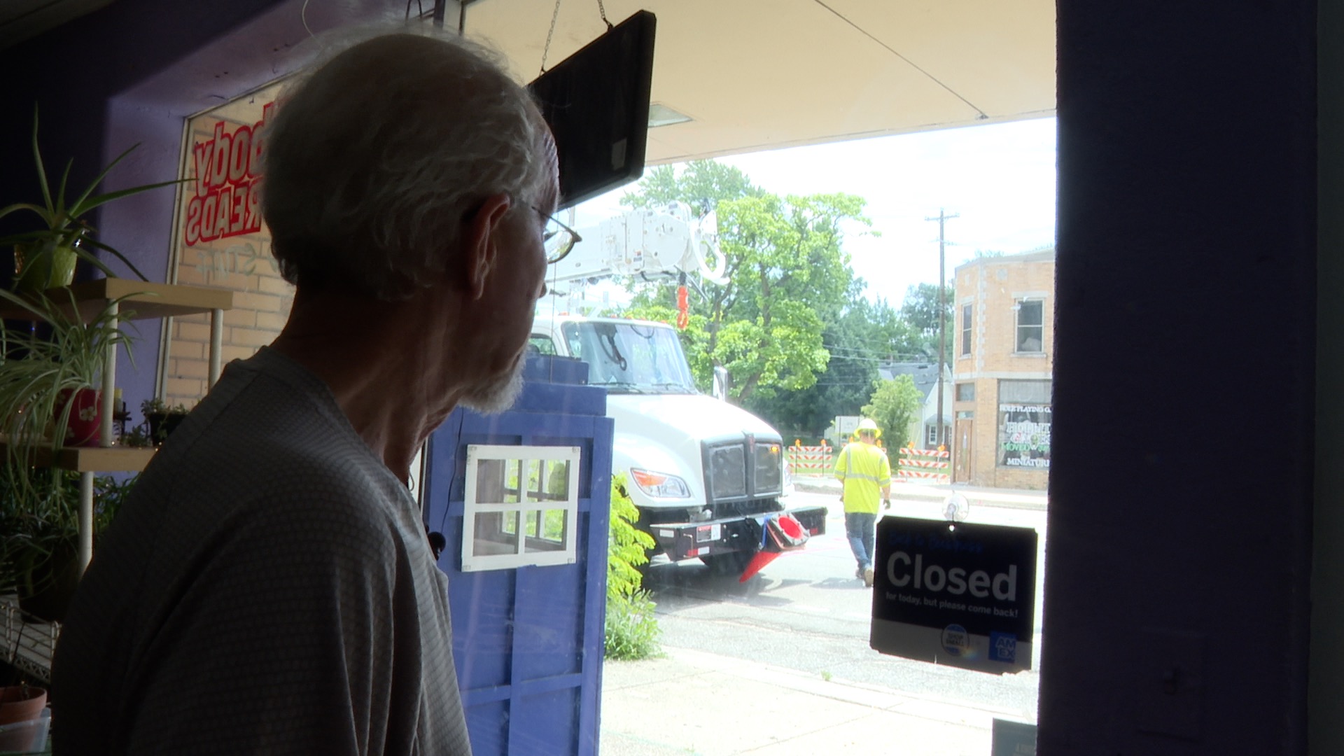 Bookstore owner looks at construction outside on Michigan Avenue
