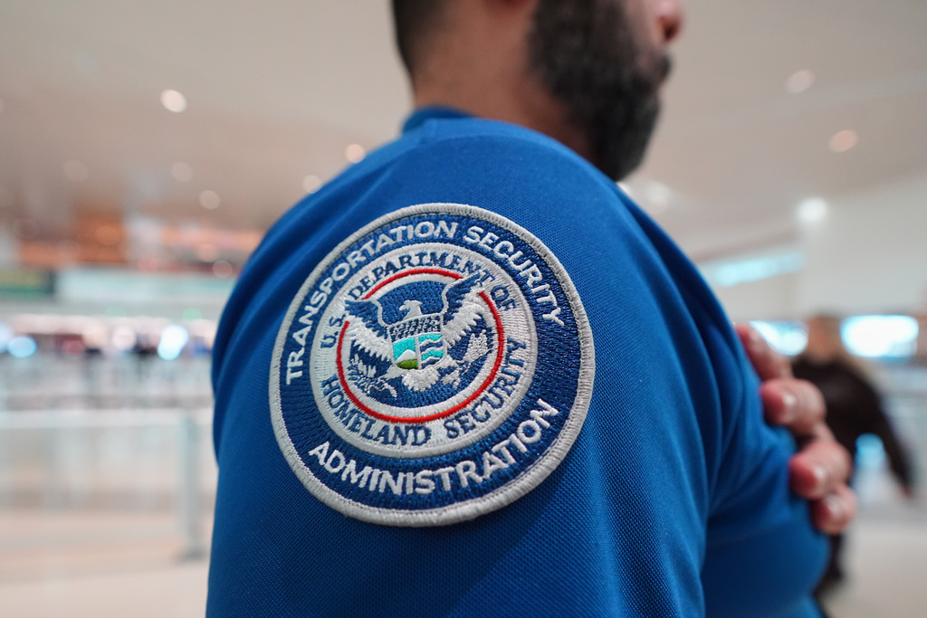 A TSA agent wears a U.S. Department of Homeland Security patch on their uniform at Love Field Airport, in Dallas, Wednesday, Feb. 18, 2026.