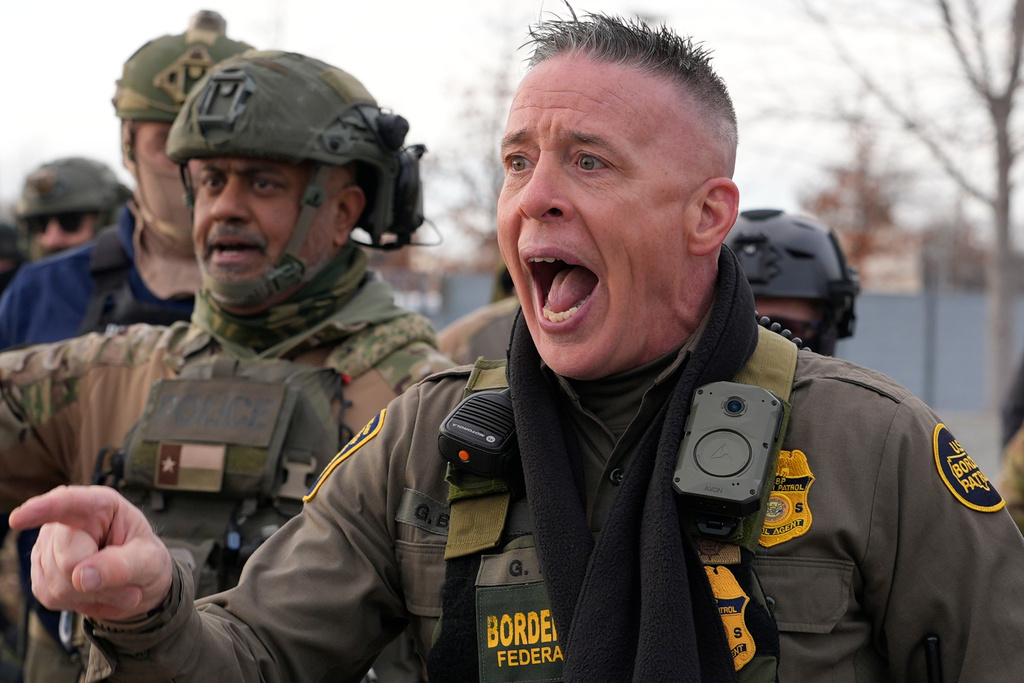 U.S. Border Patrol Cmdr. Gregory Bovino shouts at protesters, Sunday, Jan. 11, 2026, 