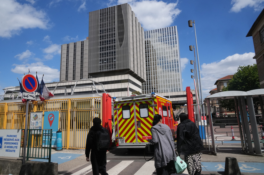 An ambulance enters the Bichat Hospital where a woman who tested positive for hantavirus remains in intensive care, in Paris, Tuesday, May 12, 2026. 