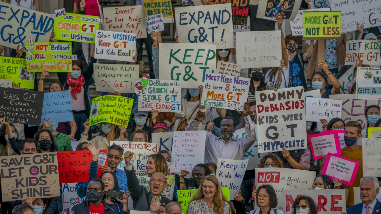 People protesting at New York City Hall against Mayor Bill de Blasio's plan to phase out the Gifted and Talented program.