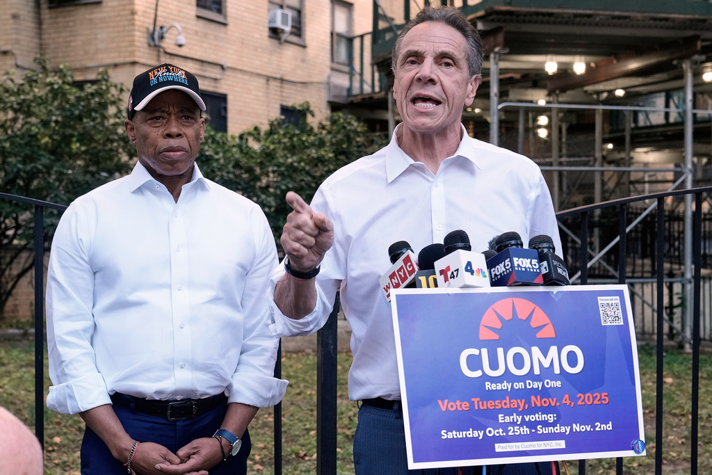New York Mayor Eric Adams, left, and Democrat mayoral candidate Andrew Cuomo appear at a campaign event outside the George Washington Carver Houses, in New York.