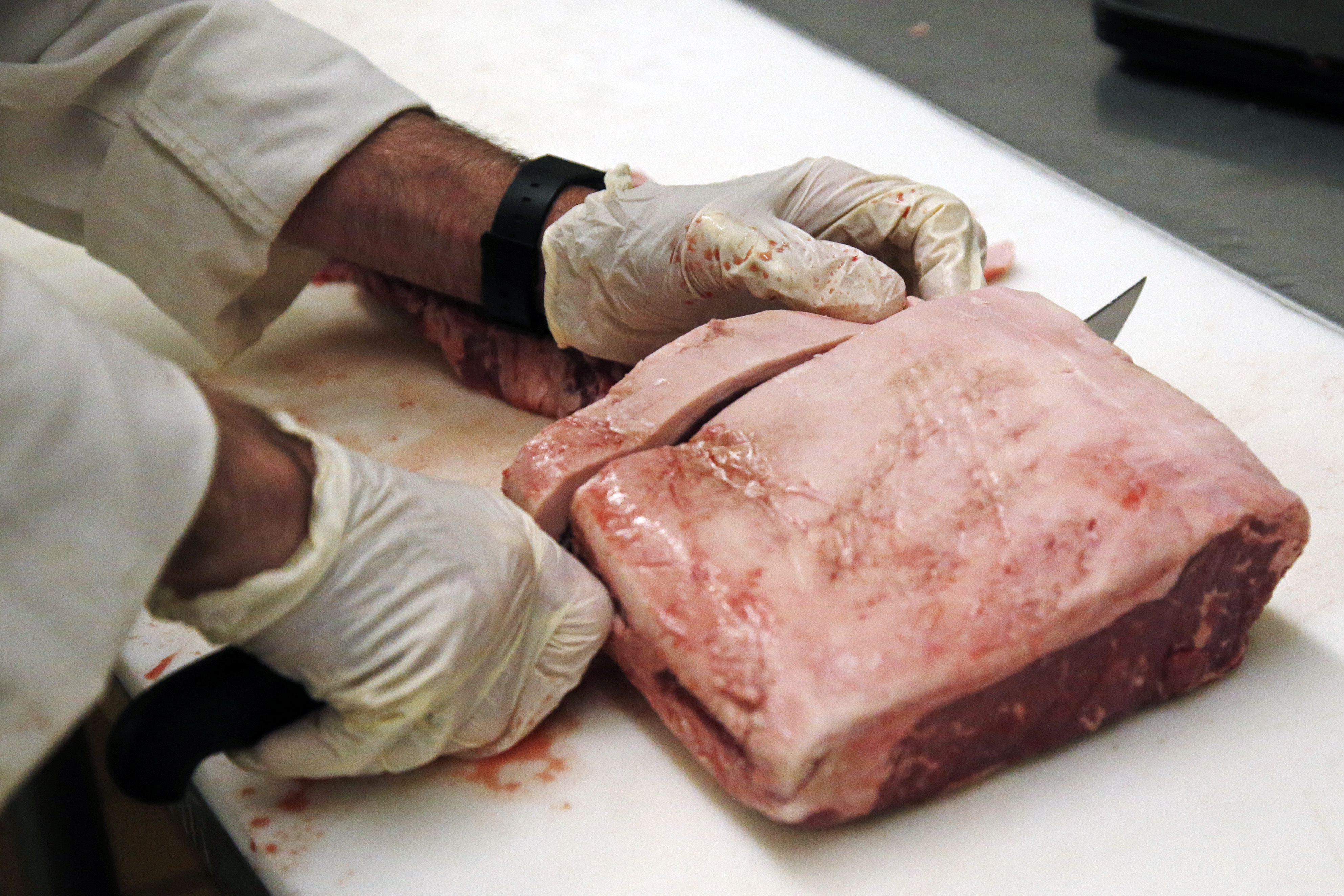 Butcher Cutting Meat - AP