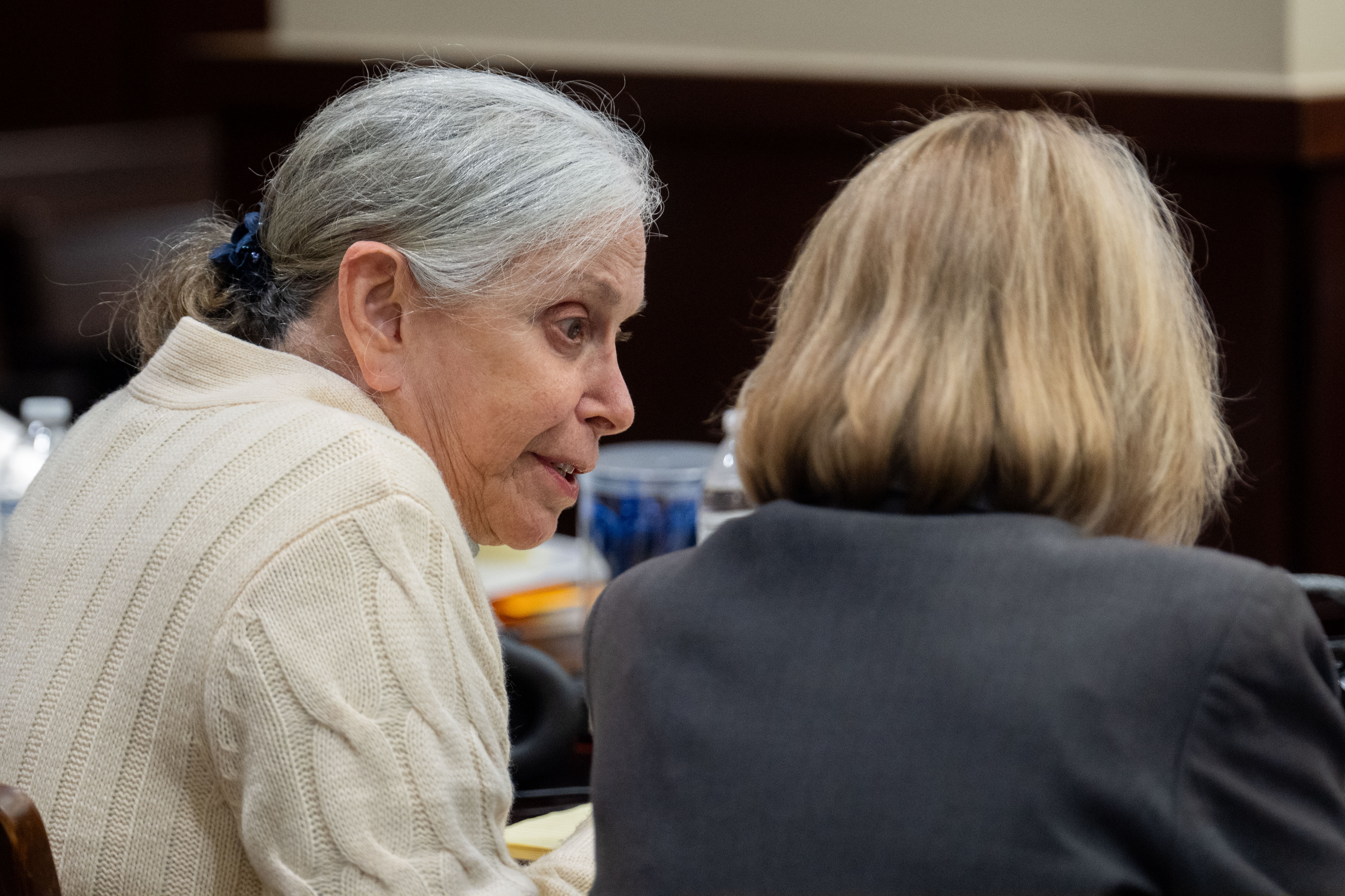 Donna Adelson speaks with her attorney, Jackie Fulford, during her trial  