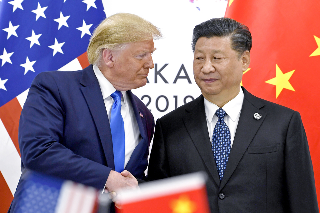 President Donald Trump, left, shakes hands with China's President Xi Jinping during a meeting on the sidelines of the G-20 summit in Osaka, Japan, June 29, 2019. 