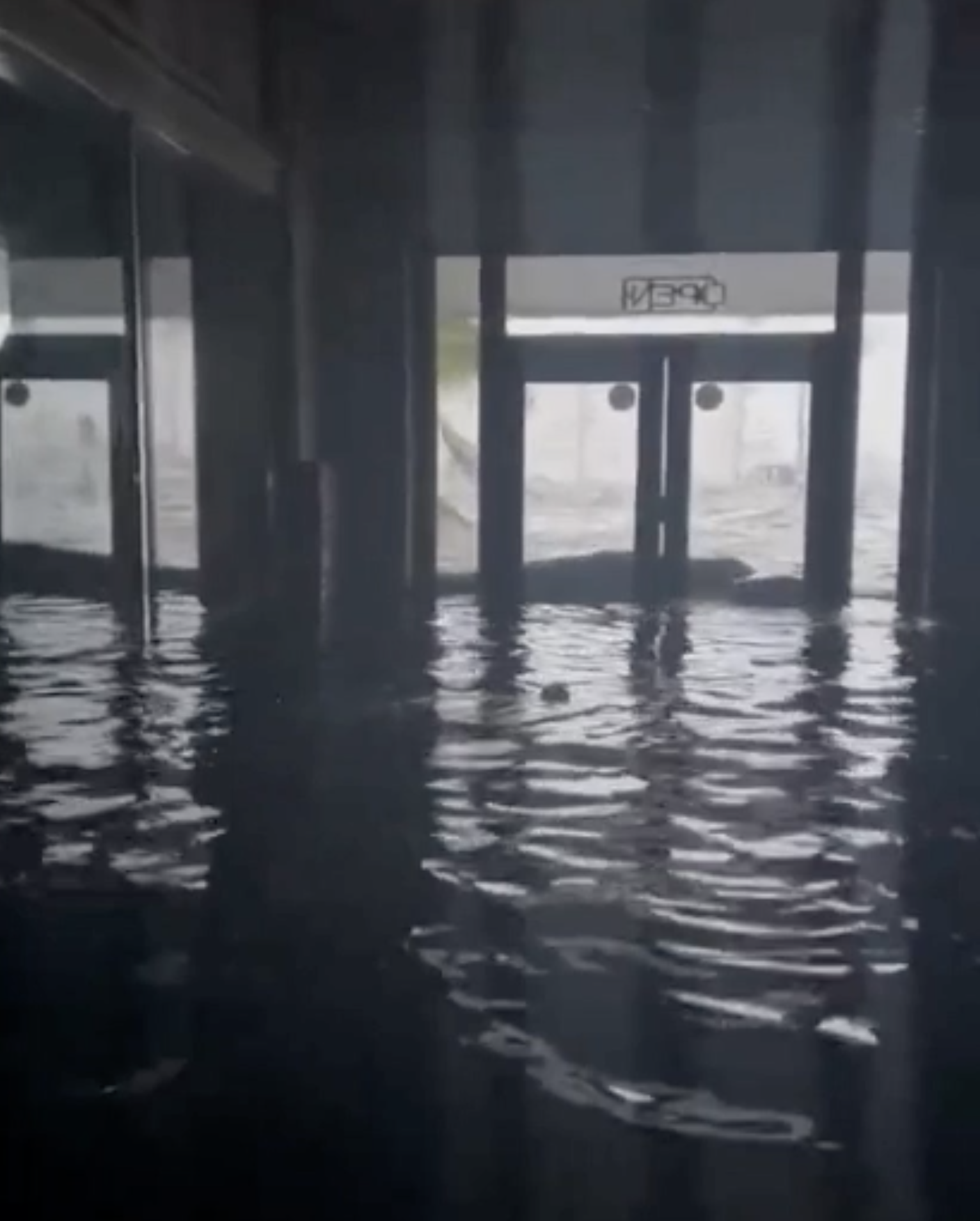 Flooding inside the Florida Repertory Theatre looking out towards Bay Street and the Caloosahatchee River.