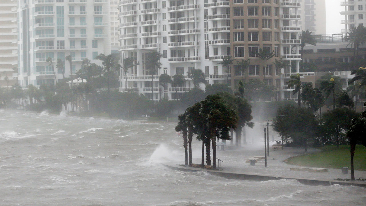 Waves crash over a seawall at the mouth of the Miami River from Biscayne Bay, Fla., as storm surge from Hurricane Irma impacts Miami on Sept. 10, 2017.