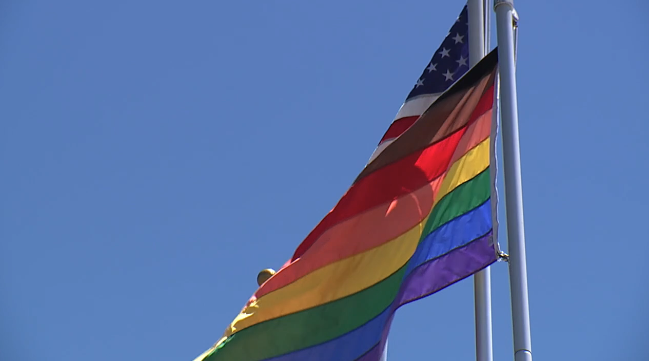 Pride flag and American flag