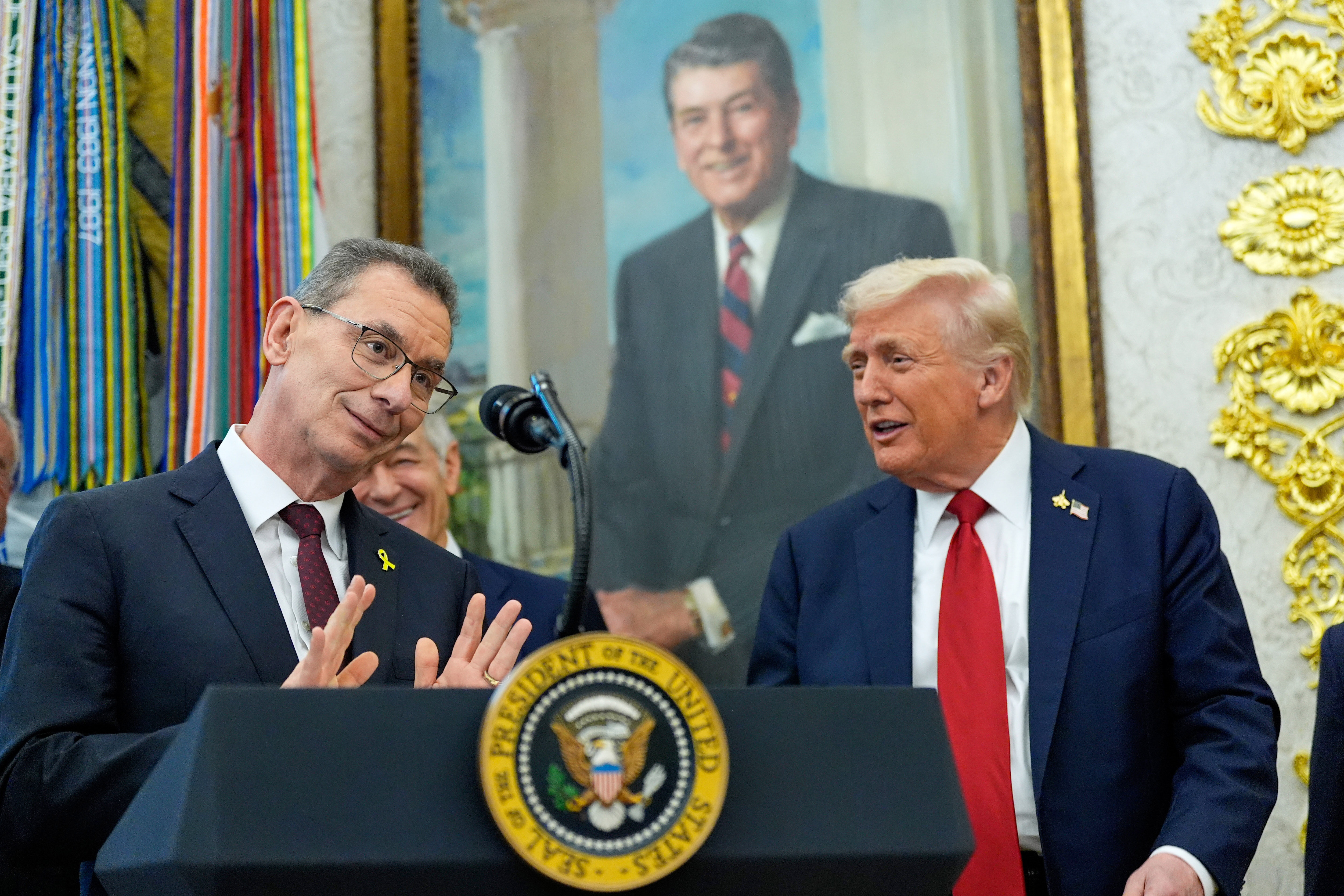 Albert Bourla, chairman and chief executive officer of the pharmaceutical company Pfizer. speaks in the Oval Office of the White House, Tuesday, Sept. 30, 2025, in Washington, as President Donald Trump, right, and Mehmet Oz, Administrator for the Centers for Medicare & Medicaid Services, rear, look on. 