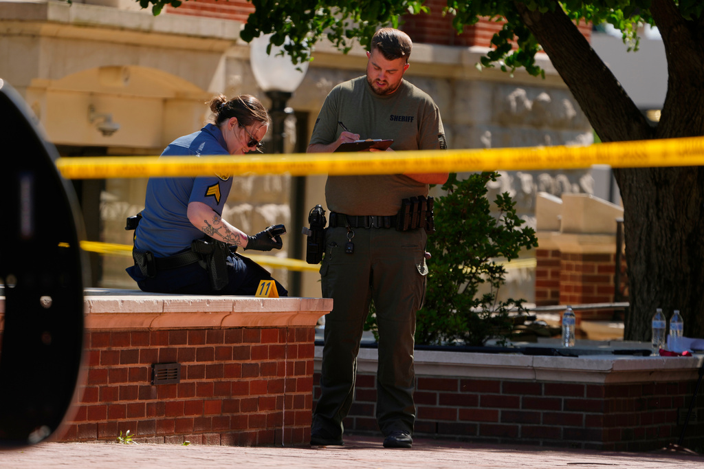 Sheriff's deputies investigate a shooting scene outside the Montgomery County Courthouse, Wednesday, May 13, 2026, in Clarksville, Tenn. 