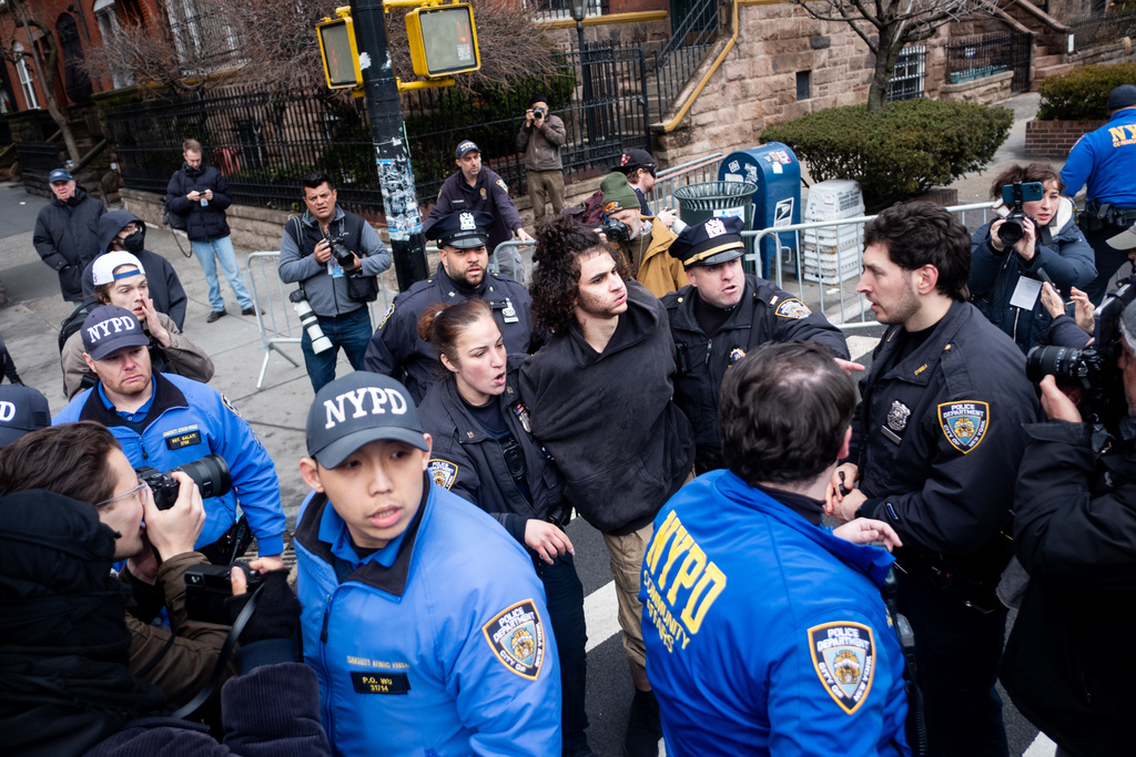 Police detain Emir Balat after he attempted to detonate an improvised explosive device during a counterprotest against far right influencer Jake Lang staging an anti-Islam protest outside Gracie Mansion, Saturday, March 7, 2026, in New York.