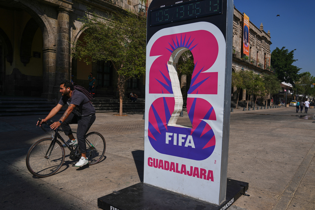 A cyclist rides past an installation promoting the FIFA World Cup 2026 in Guadalajara, Mexico.