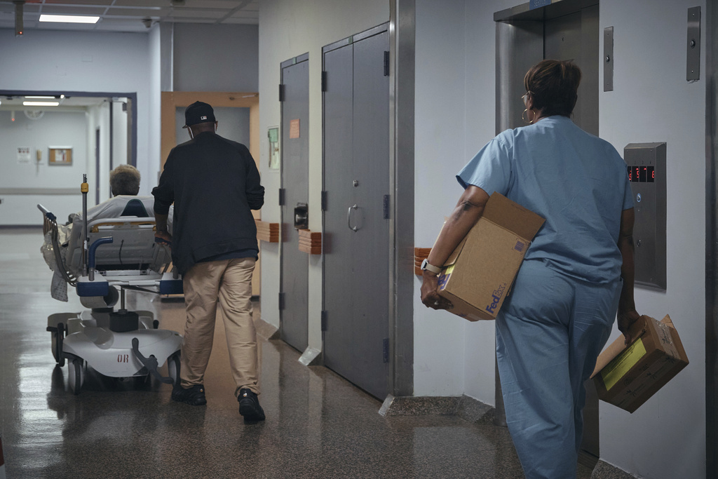 A nurse transports a patient on a stretcher inside Brookdale University Hospital and Medical Center on Tuesday, July 1, 2025, in the Brooklyn borough of New York. 
