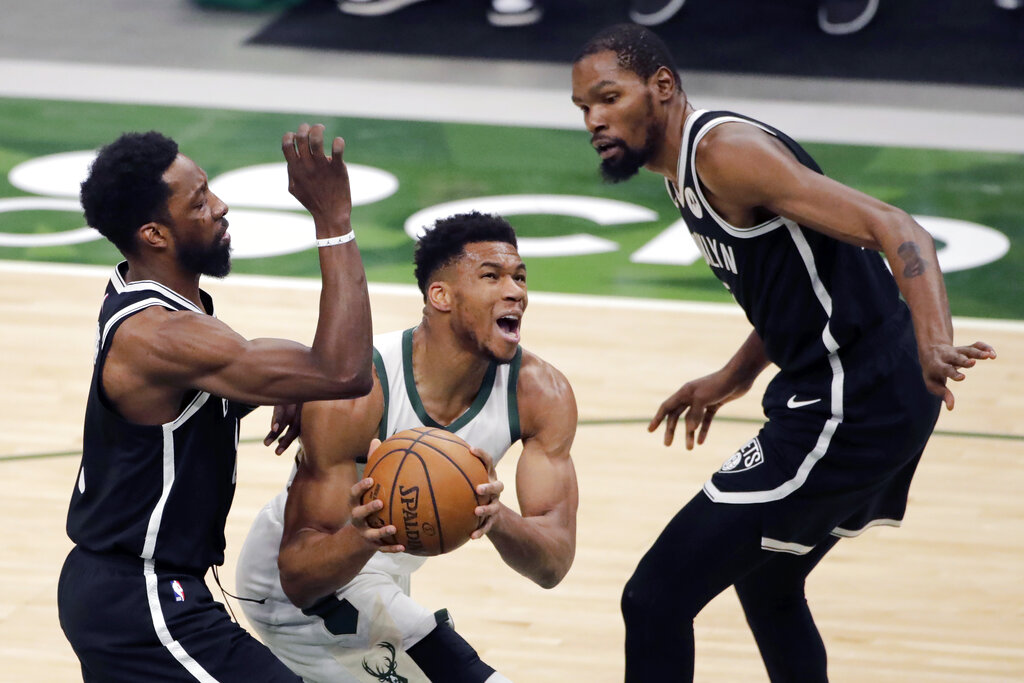 Bucks Rally In 4th To Beat Nets 124 118 Clinch Playoff Spot