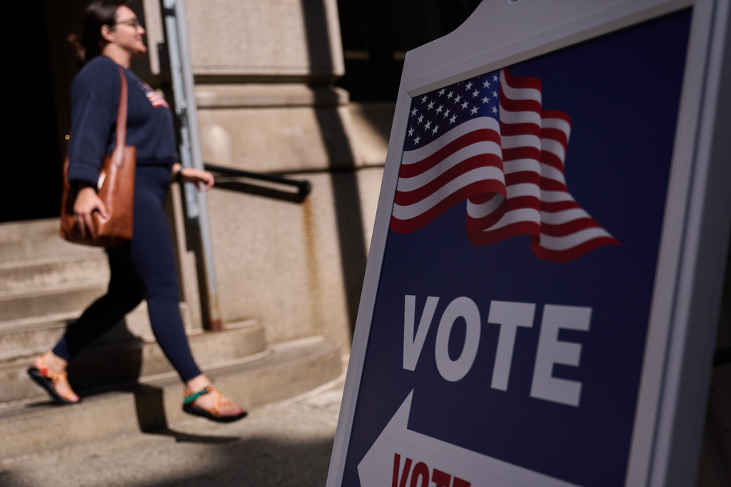 A sign directs voters to an entrance for City Hall during early voting for the Rhode Island primary election, Wednesday, Sept. 2, 2026, in Providence, R.I.