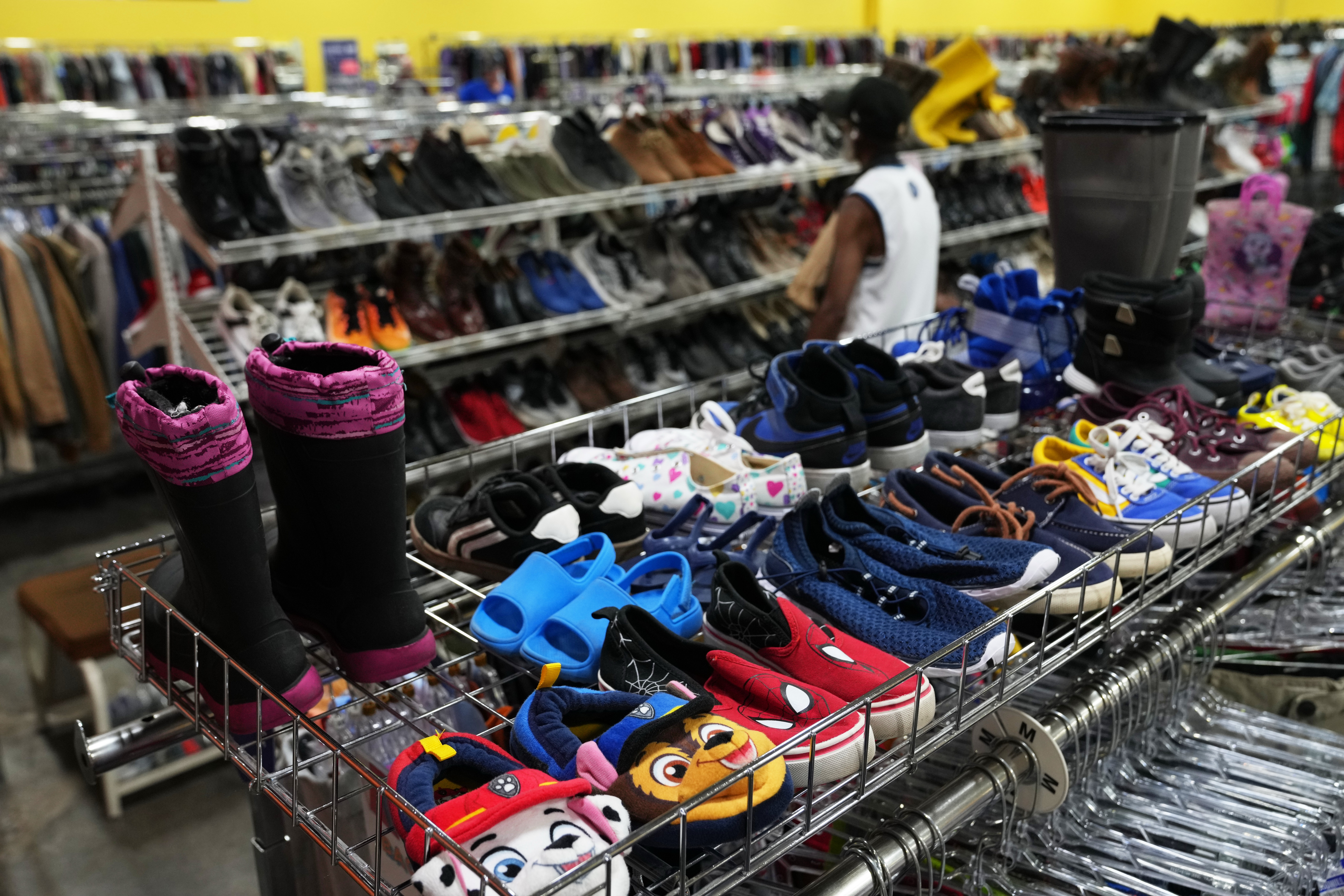 FILE - The children's shoe section is seen at a Goodwill store in Roseville, Minn., Aug. 12, 2026.