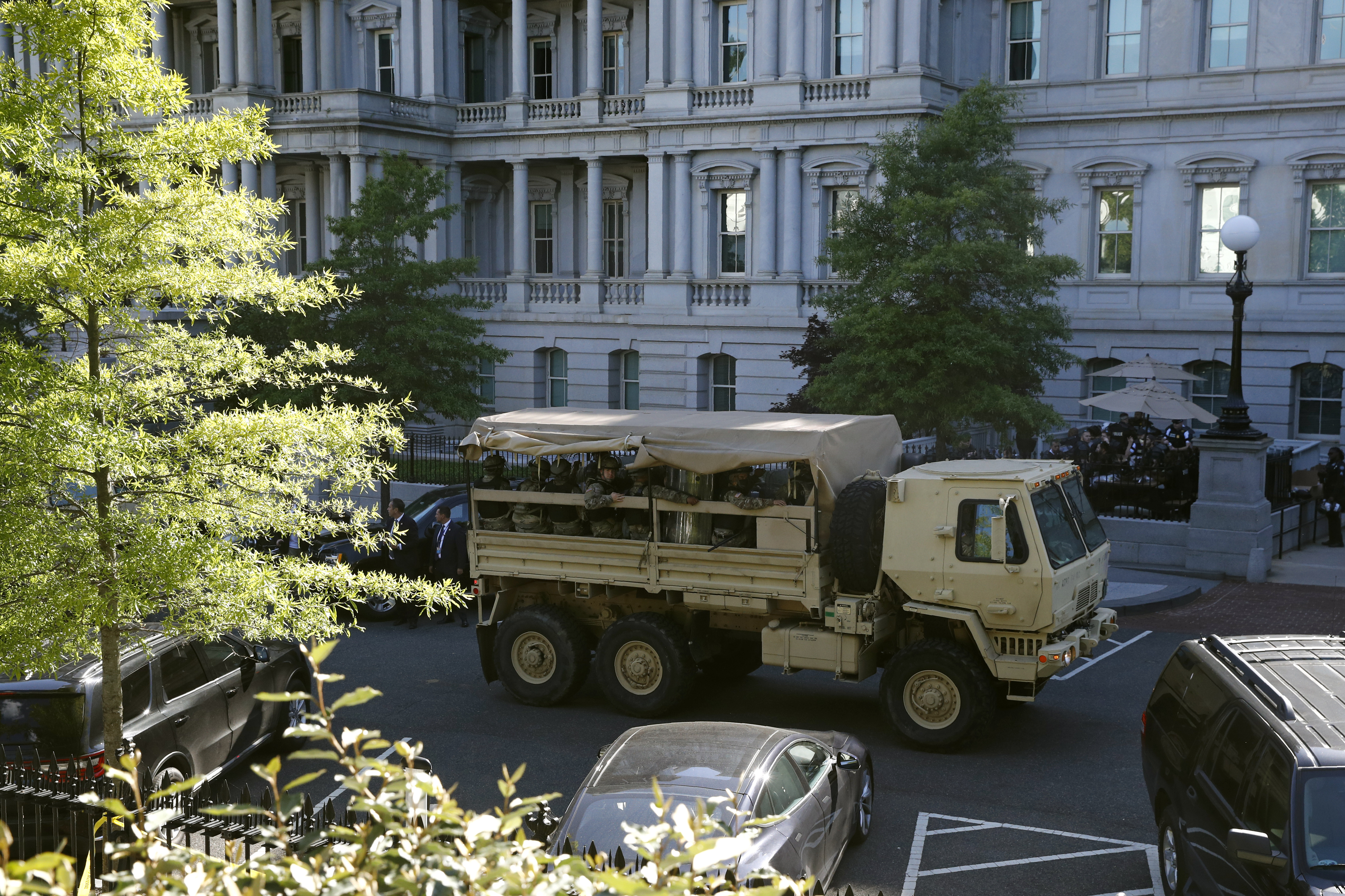 Active troops, military vehicles guard the White House