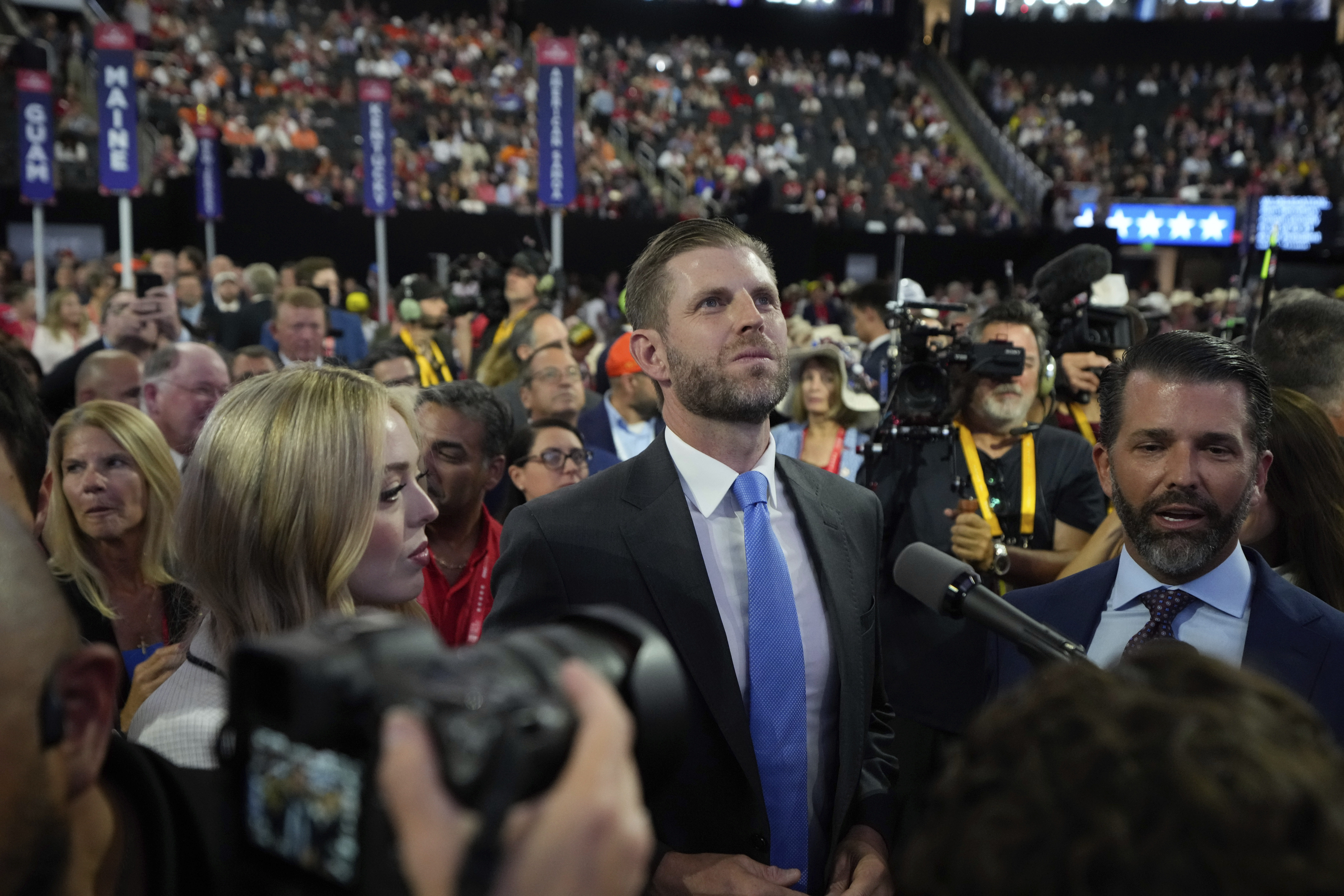 Tiffany Trump, Eric Trump and Donald Trump Jr., watch the roll call of states during the Republican National Convention.