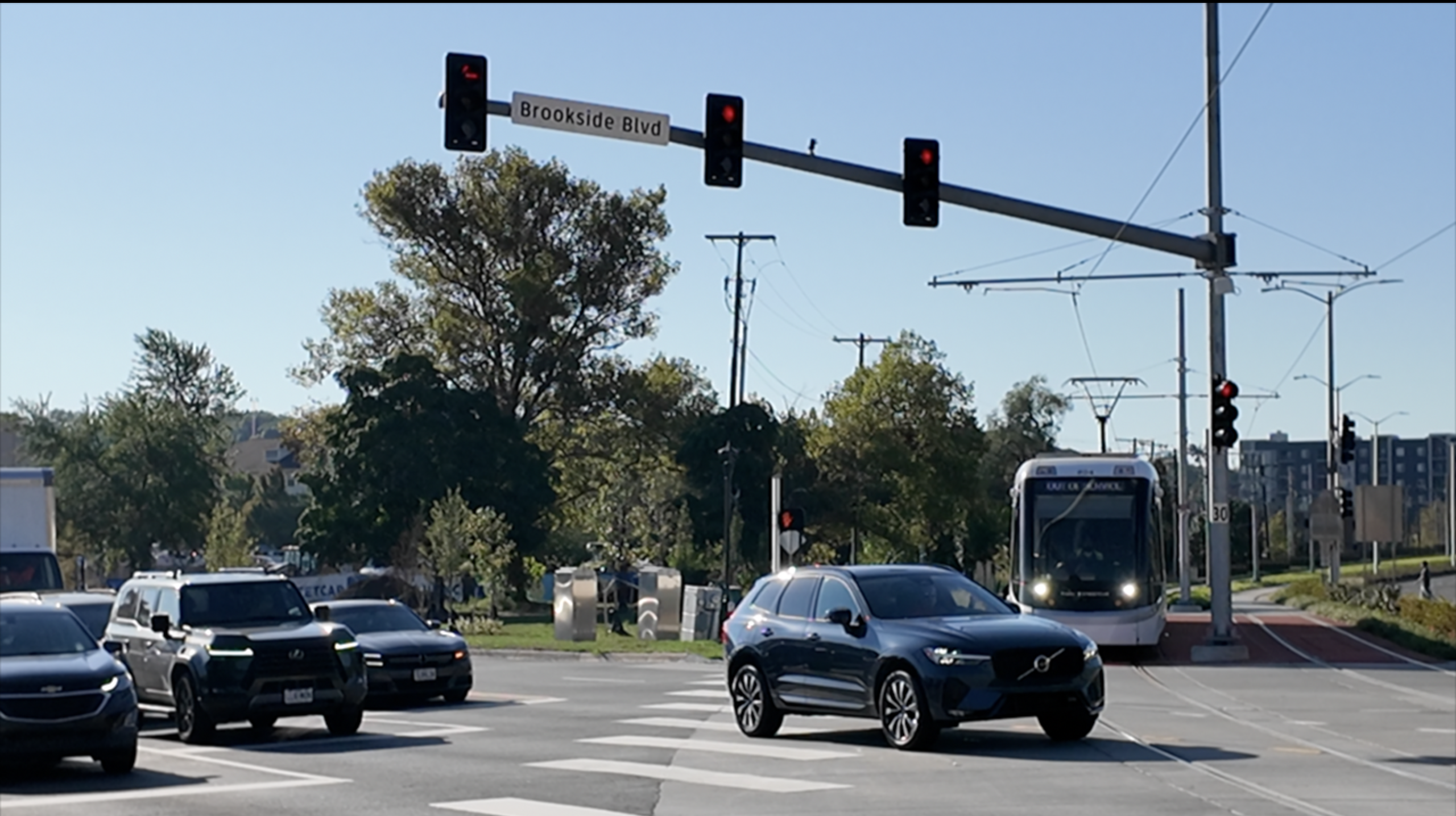 SUV blocking Streetcar tracks and pedestrian crosswalk.png