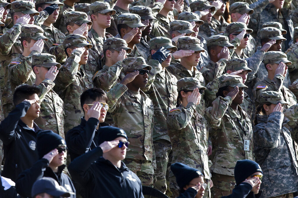 Cadets salute during the National Anthem.