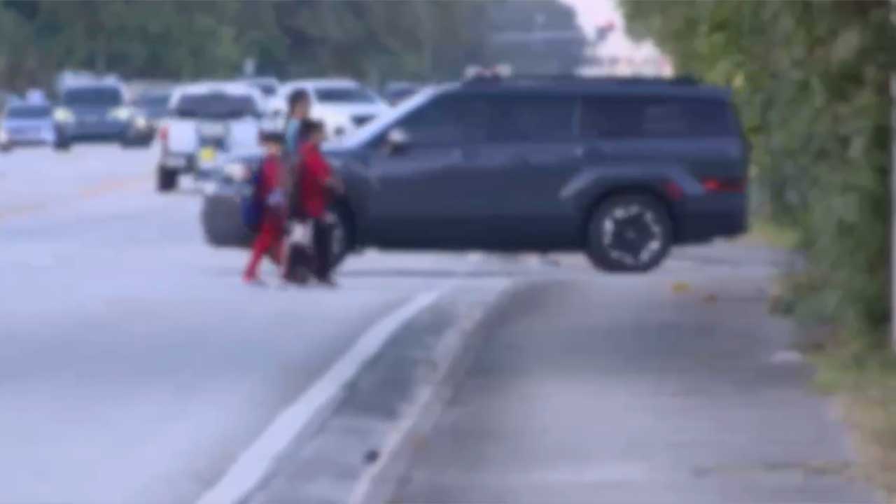 Family crossing near Greenacres Elementary School