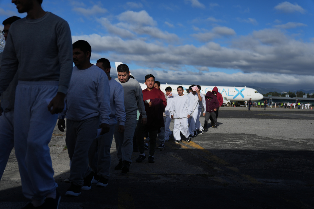 Guatemalans deported from the U.S. arrive at La Aurora airport in Guatemala City, Tuesday, Dec. 30, 2025, after deplaning a repatriation flight.