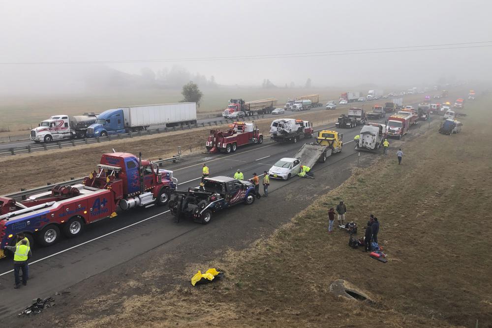This photo released by the Oregon State Police shows the scene where one person was killed in a multi-vehicle crash in heavy fog on Interstate 5 north of Eugene, Ore., Wednesday, Oct. 19, 2022. Oregon State Police say the crashes in the southbound lanes of the interstate involved about 60 vehicles including up to 20 semi trucks. (Oregon State Police via AP)
