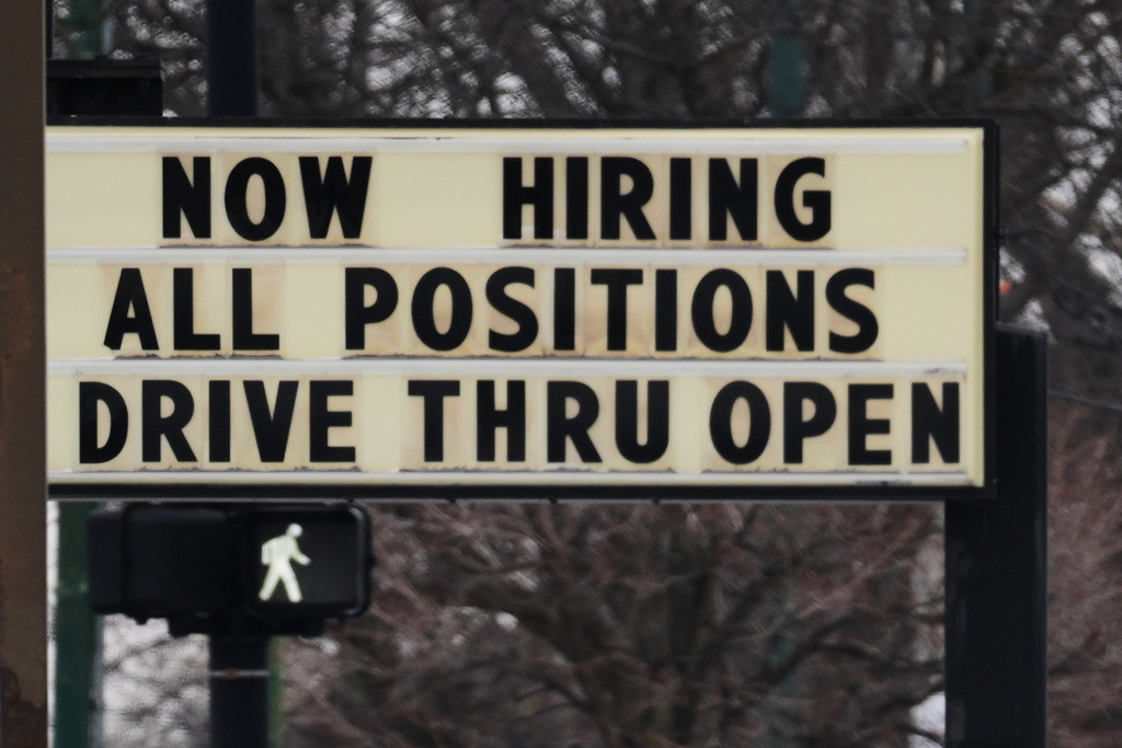 Hiring sign is displayed in front of a restaurant in Chicago, Thursday, Feb. 5, 2026. 