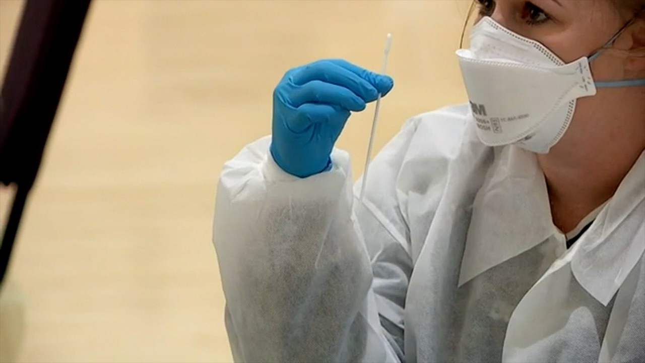 Lab worker with a swab